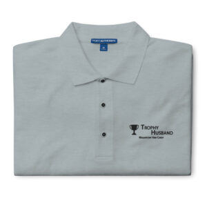 Embroidered – Magnificent Arm Candy  – Trophy Husband. Premium Polo – Light Colors